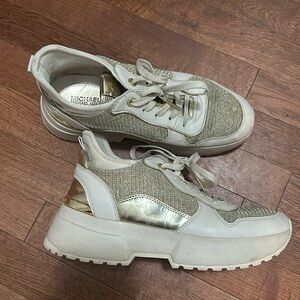 Michael Kors snickers barely worn wedge style snicker Gold